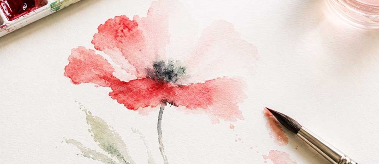 Watercolour painting of a red flower with paintbrush
